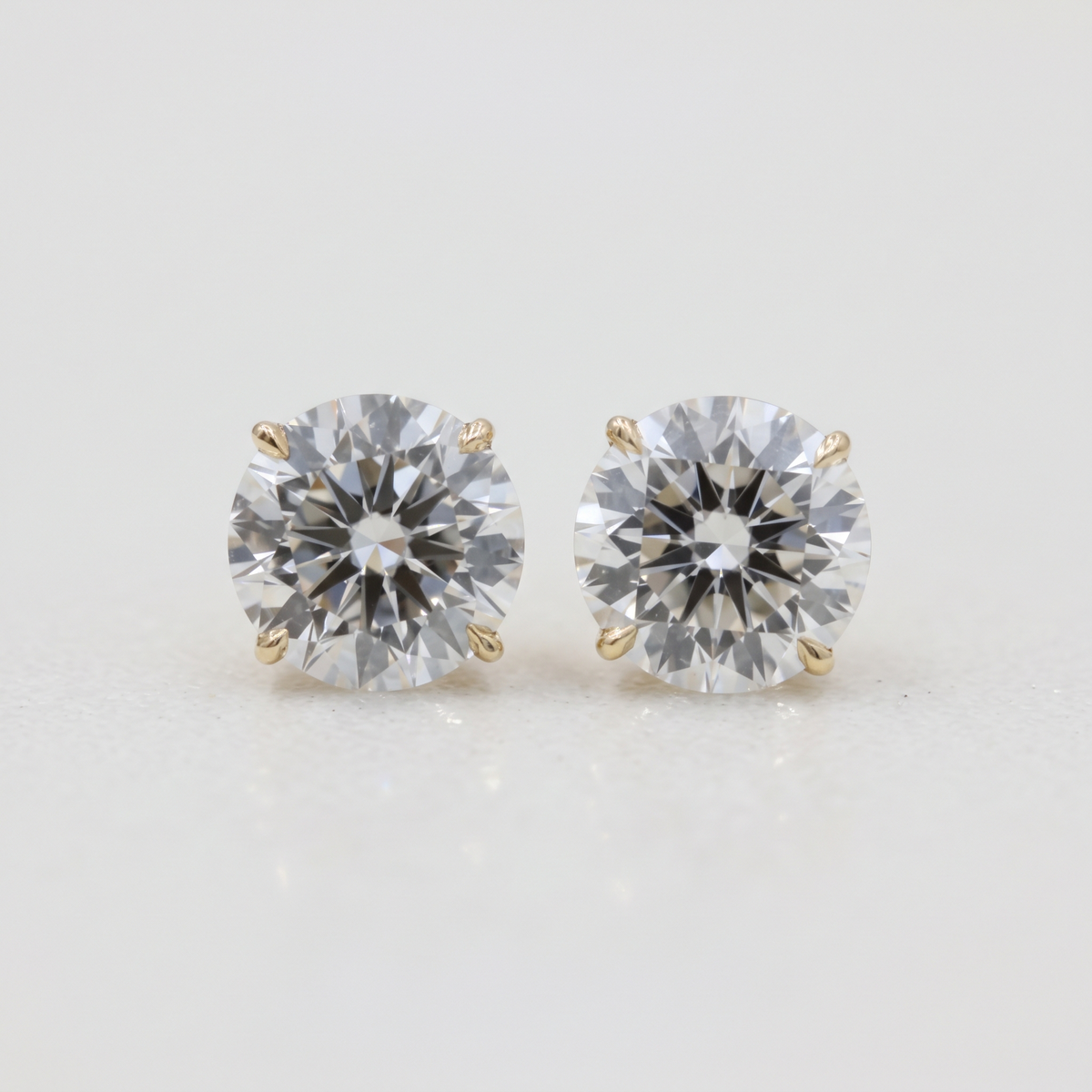Lab Grown Round Brilliant Cut Diamond Solitaire Stud Earrings with Four-Prong Setting in 14K Yellow Gold