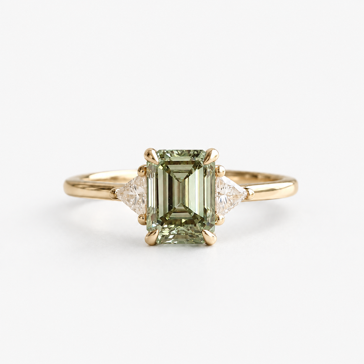 Lab Grown Green Emerald Cut Three Stone Engagement Ring with Trillion Diamond Side Accents in 14K Yellow Gold