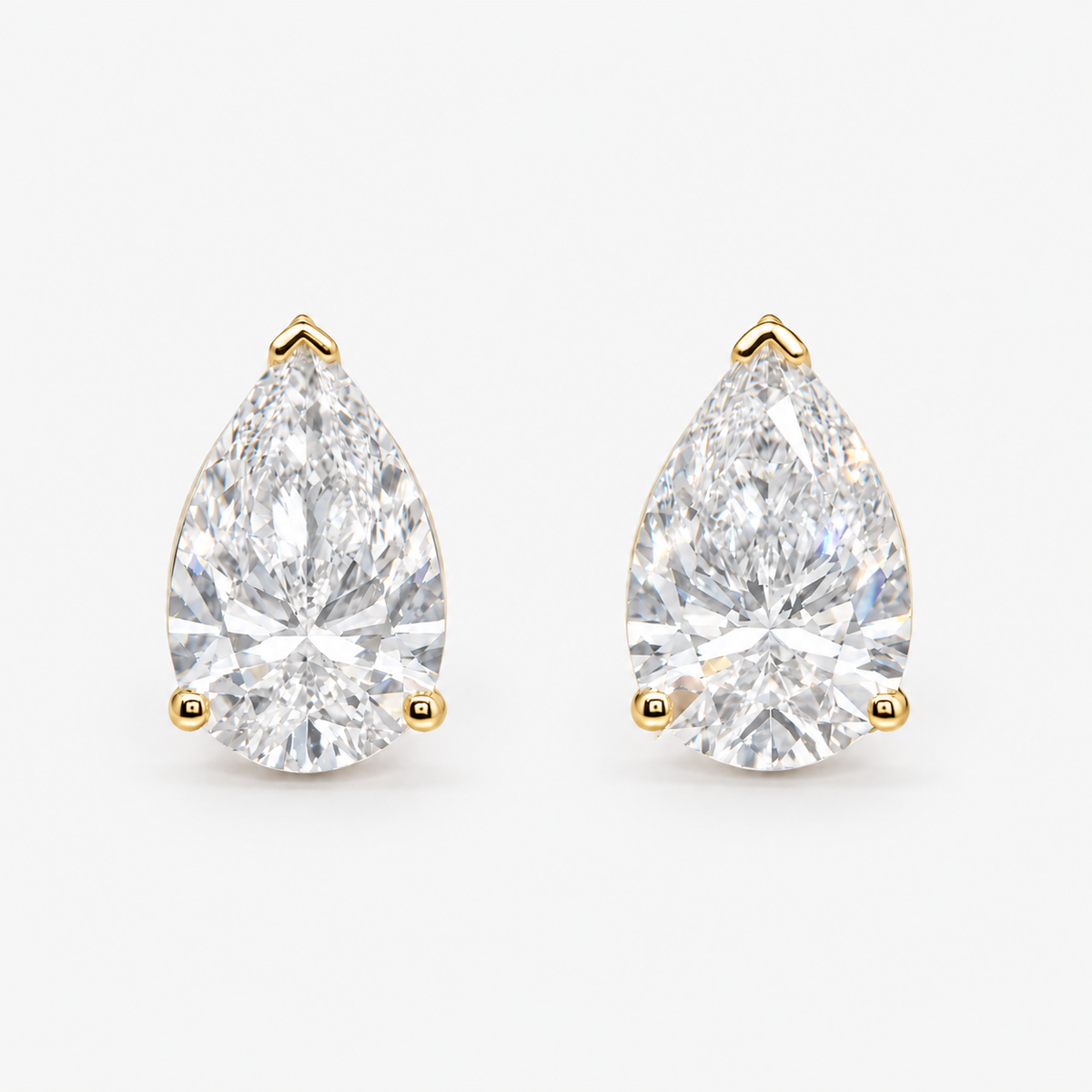Lab Grown Diamond Pear Cut Three-Prong V-Cap Setting Stud Earrings IGI Certified in 14K Yellow Gold