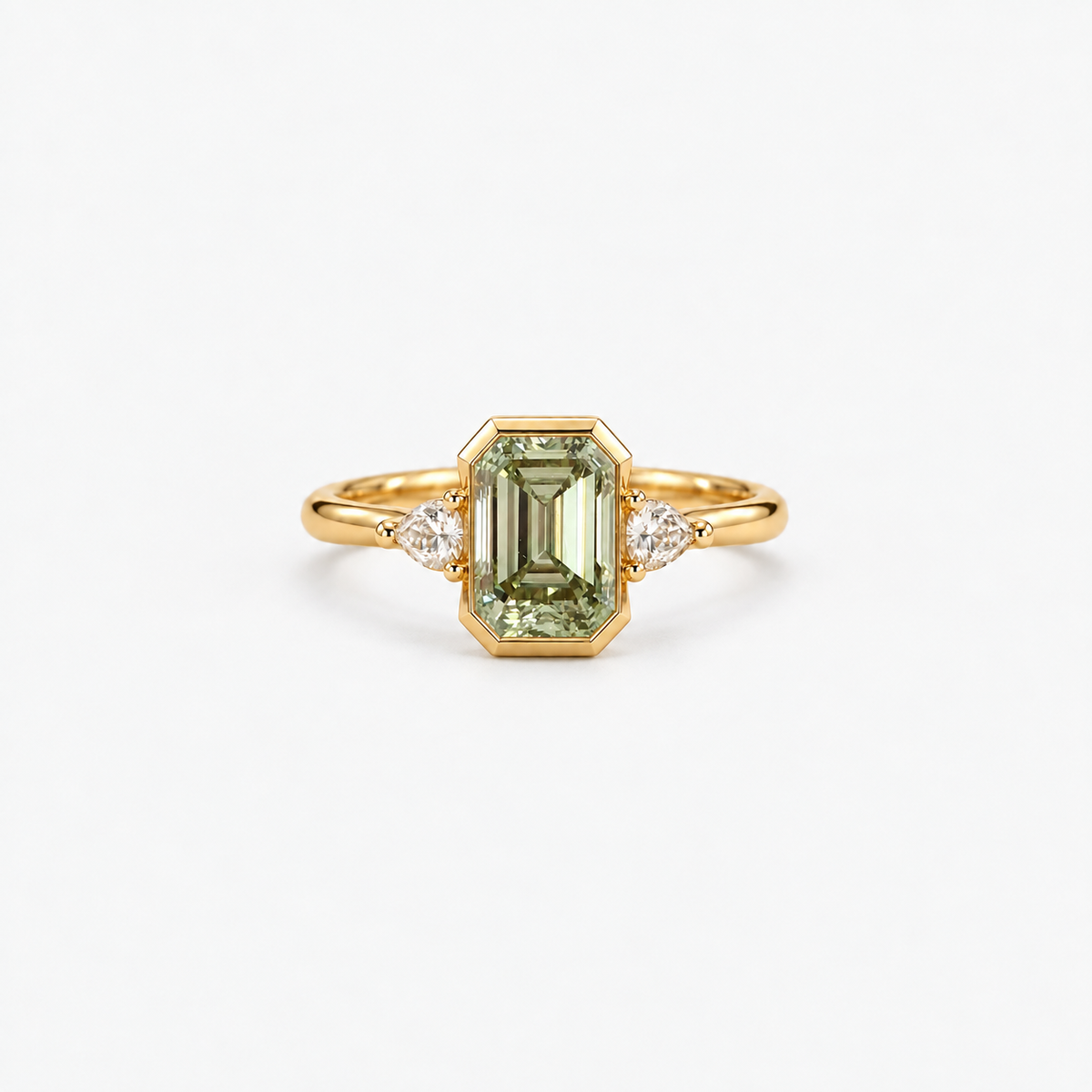 Lab Grown Green Emerald Cut Three Stone Engagement Ring with Pear Diamond Side Accents in 14K Yellow Gold