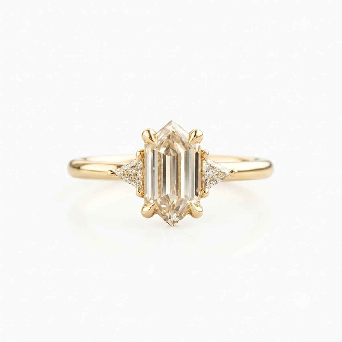 Lab Grown Diamond Elongated Hexagon Step Cut Classic Plain Solitaire Engagement Ring with Triangle Trillion Side Accents IGI Certified in 14K Yellow Gold