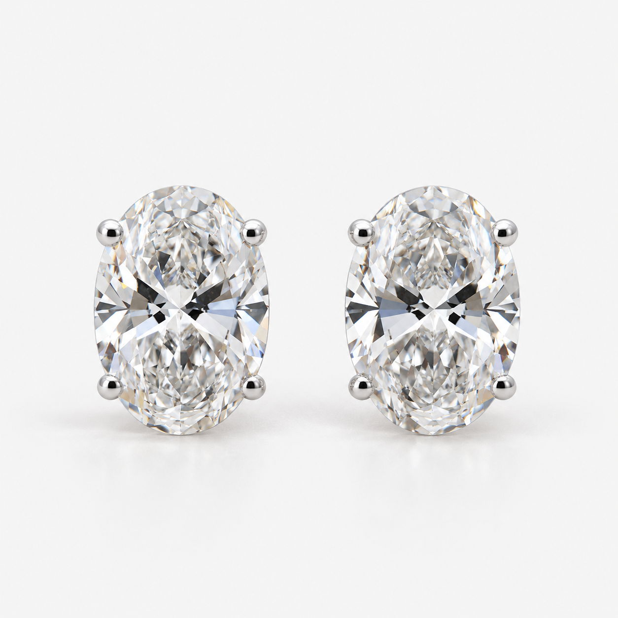 Lab Grown Diamond Oval Cut Solitaire Stud Earrings in Three Prong Setting