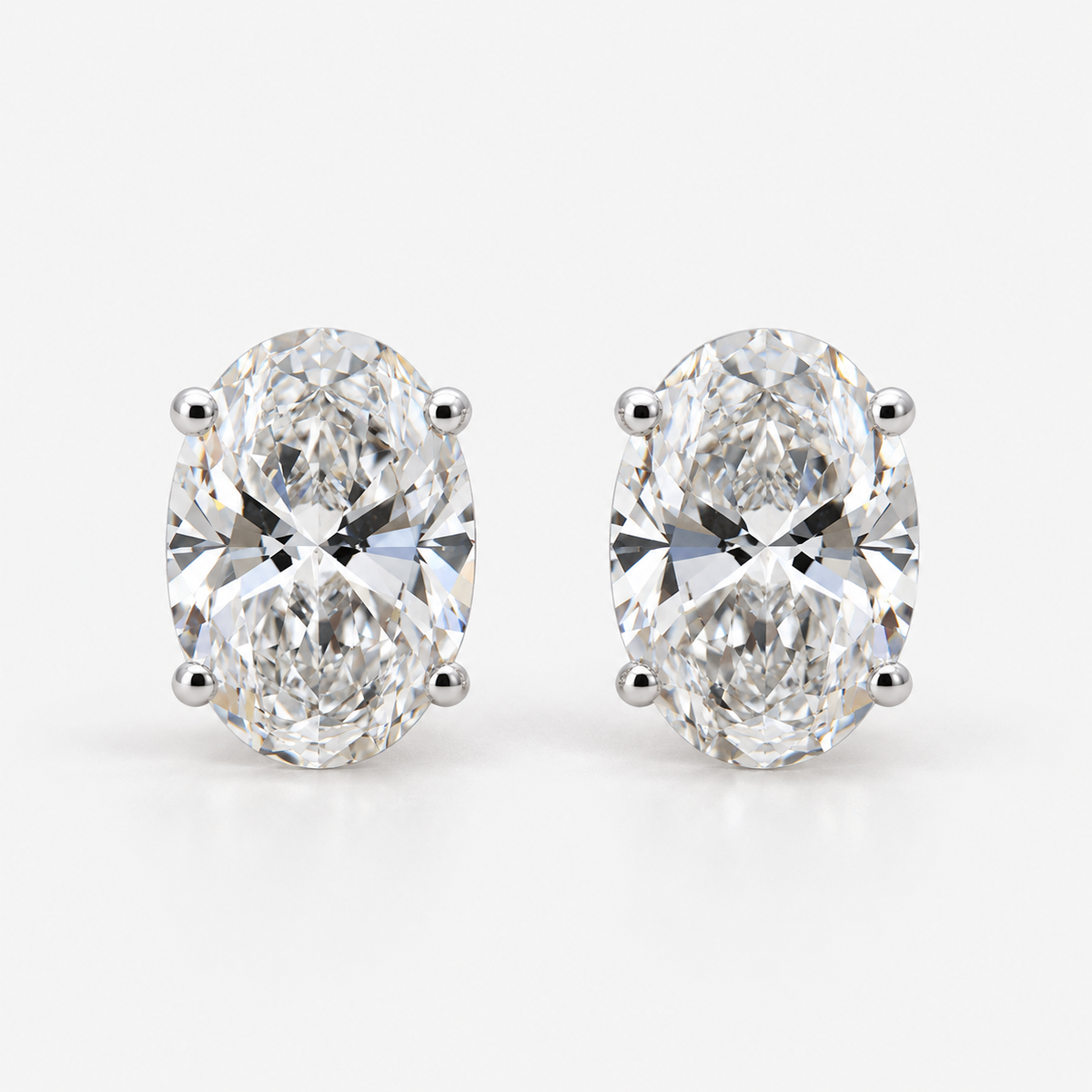 Lab Grown Diamond Oval Cut Solitaire Stud Earrings in Three Prong Setting