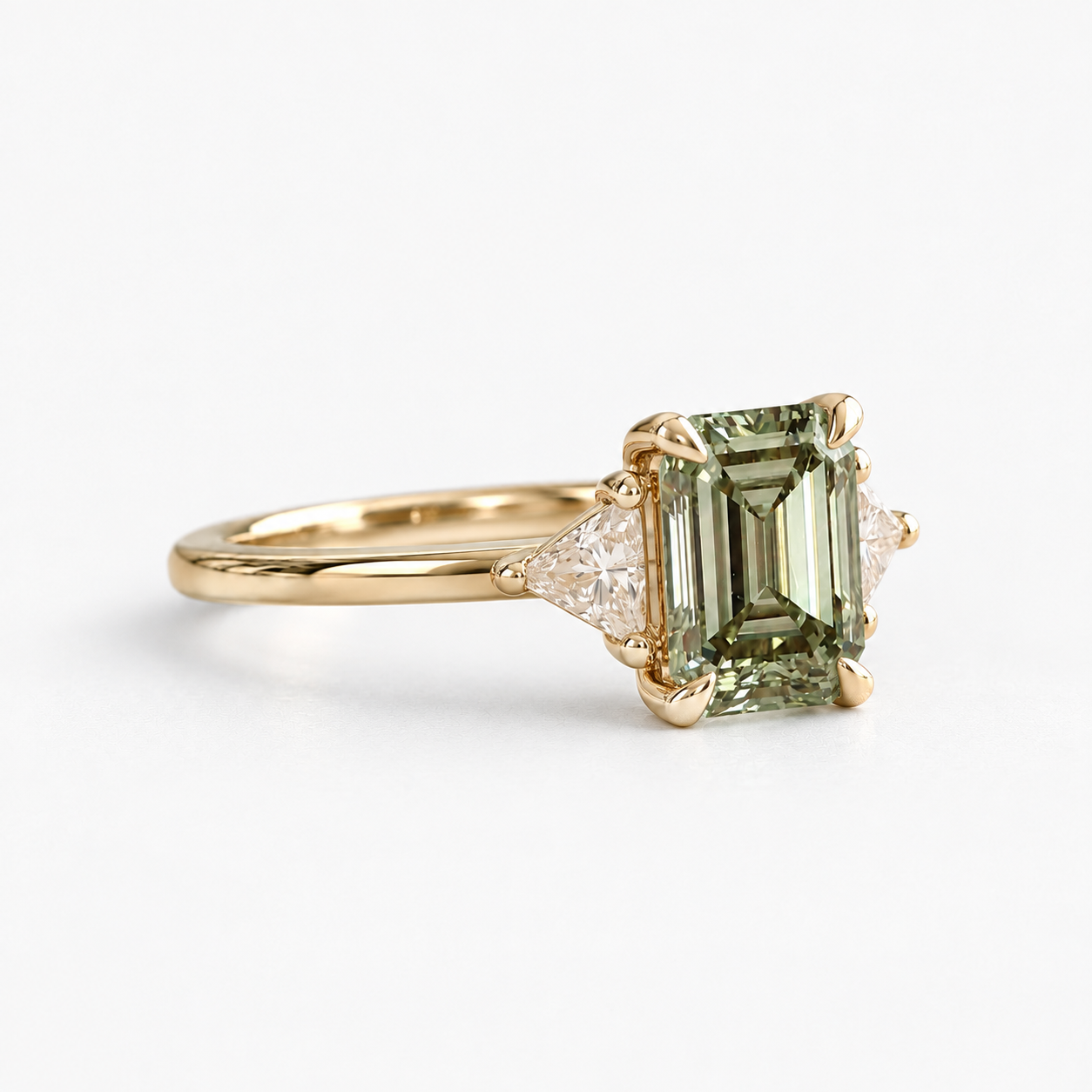 Lab Grown Green Emerald Cut Three Stone Engagement Ring with Trillion Diamond Side Accents in 14K Yellow Gold