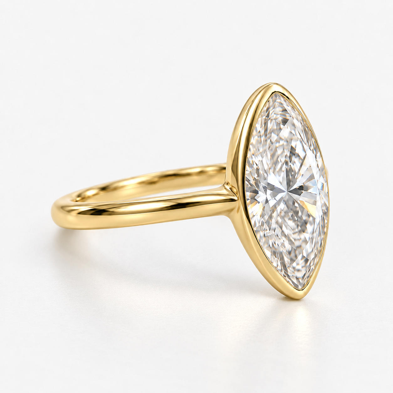 Lab Grown Diamond Moval Cut Modified Brilliant Cut Bezel Solitaire Engagement Ring IGI Certified in 14K Yellow Gold