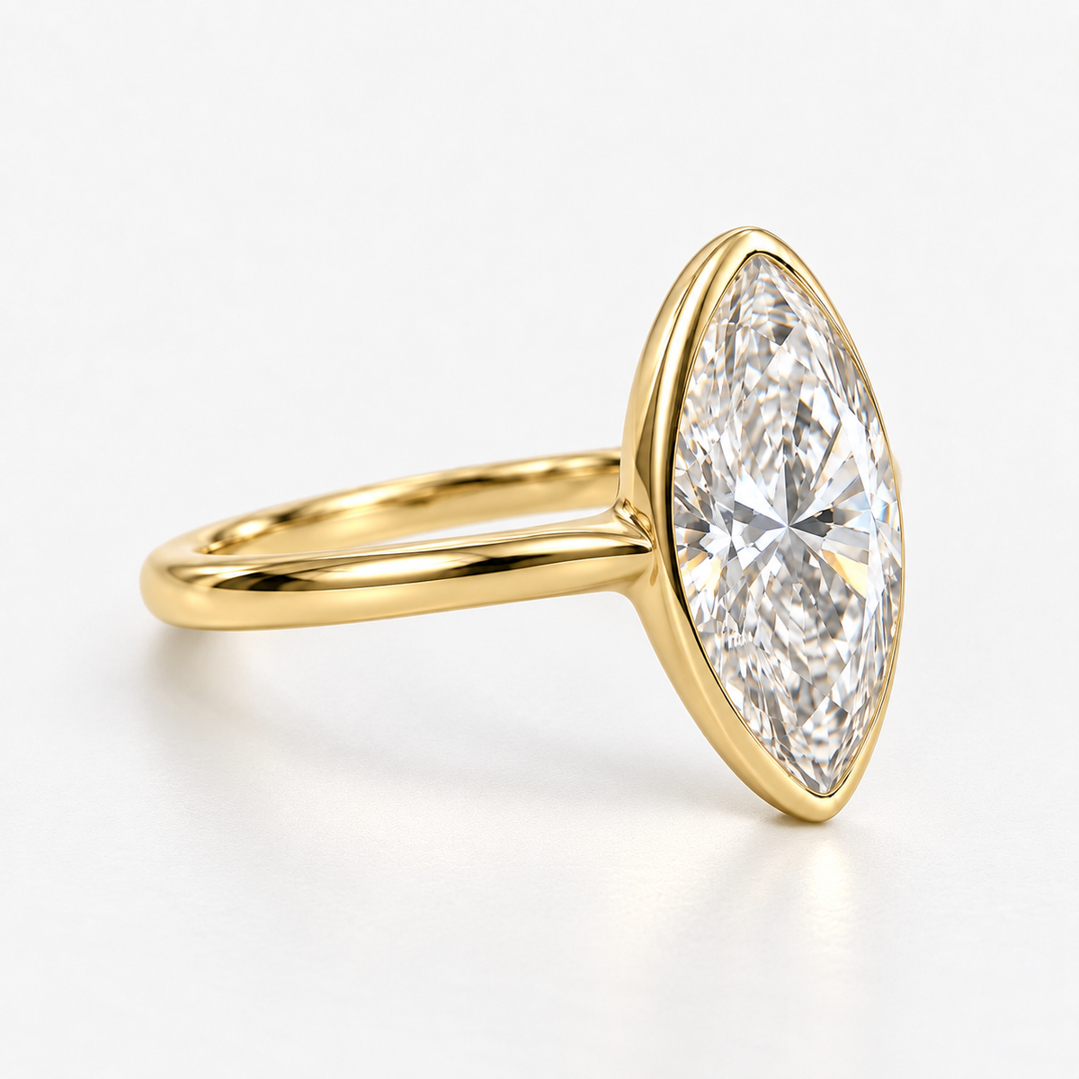 Lab Grown Diamond Moval Cut Modified Brilliant Cut Bezel Solitaire Engagement Ring IGI Certified in 14K Yellow Gold