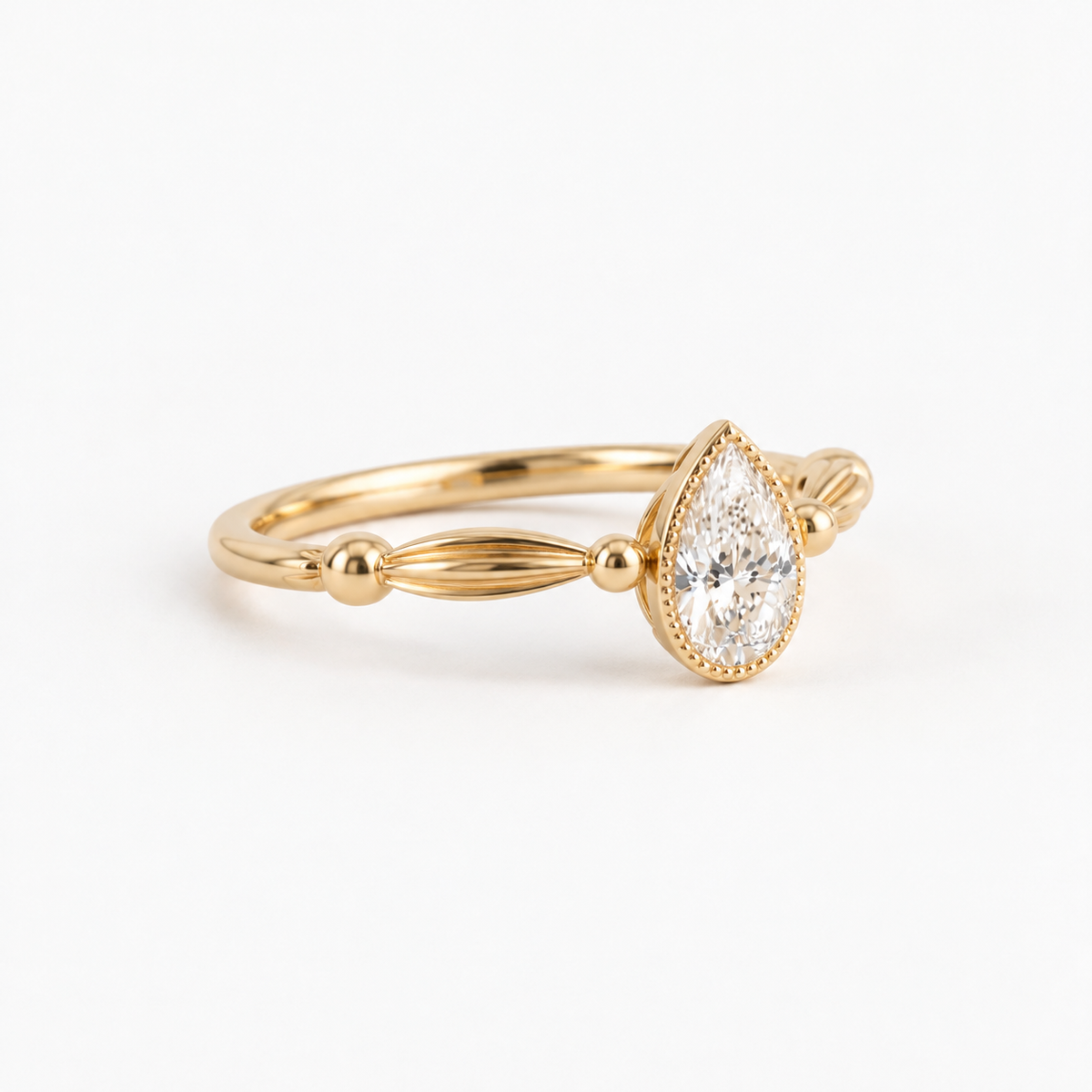 Pear Cut Diamond Bezel Engagement Ring with Vintage Inspired Band in 14K Yellow Gold