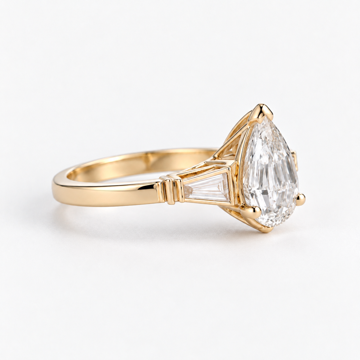 Lab Grown Diamond Pear Step Cut Three-Stone Tapered Baguette Side Accent Engagement Ring IGI Certified in 14K Yellow Gold
