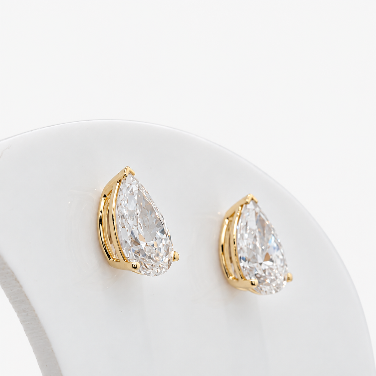 Lab Grown Diamond Pear Cut Three-Prong V-Cap Setting Stud Earrings IGI Certified in 14K Yellow Gold