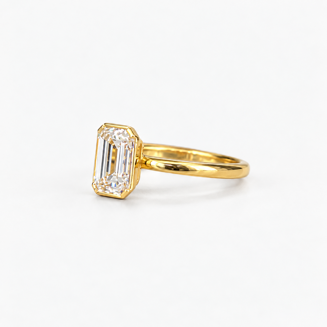 Lab Grown Diamond Emerald Cut Full Bezel Solitaire Engagement Ring with Classic Plain Band IGI Certified in 14K Yellow Gold