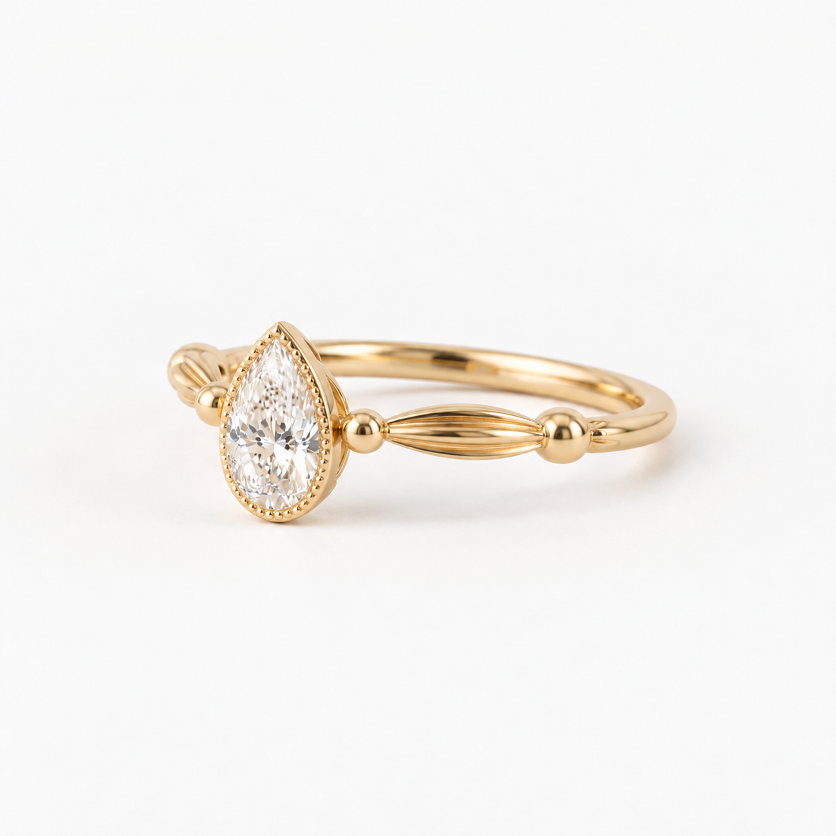 Pear Cut Diamond Bezel Engagement Ring with Vintage Inspired Band in 14K Yellow Gold