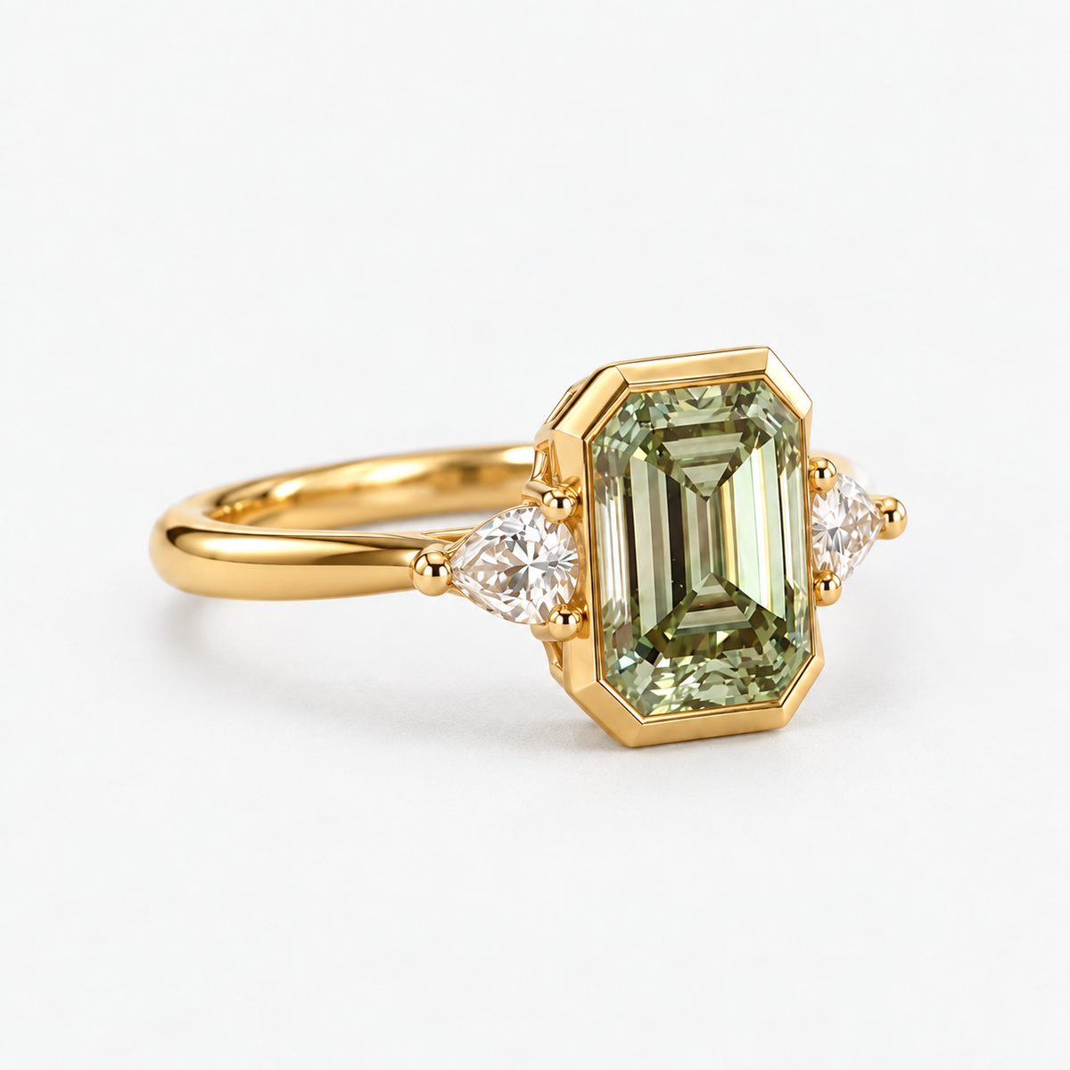 Lab Grown Green Emerald Cut Three Stone Engagement Ring with Pear Diamond Side Accents in 14K Yellow Gold