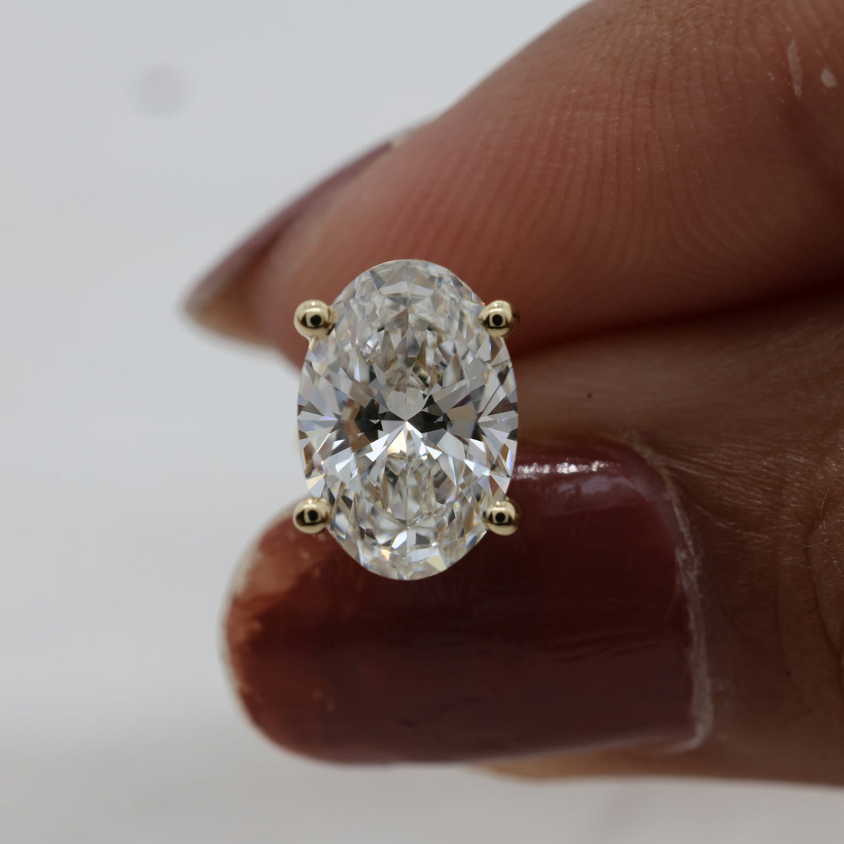 Lab Grown Oval Brilliant Cut Diamond Solitaire Stud Earring with Four-Prong Setting in 14K Yellow Gold