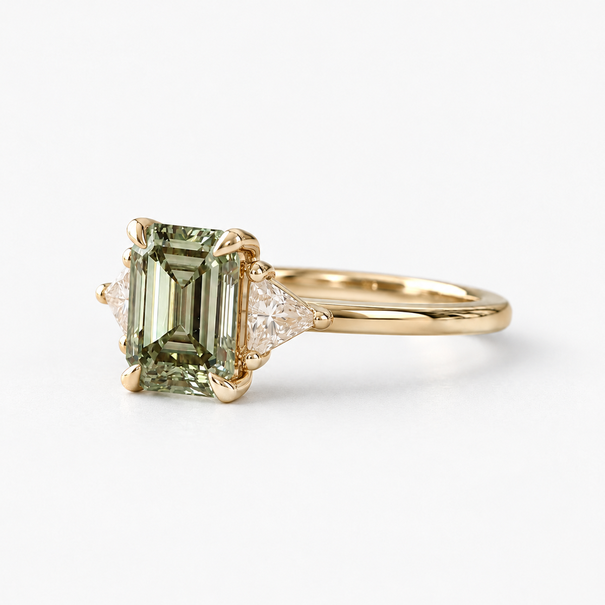 Lab Grown Green Emerald Cut Three Stone Engagement Ring with Trillion Diamond Side Accents in 14K Yellow Gold