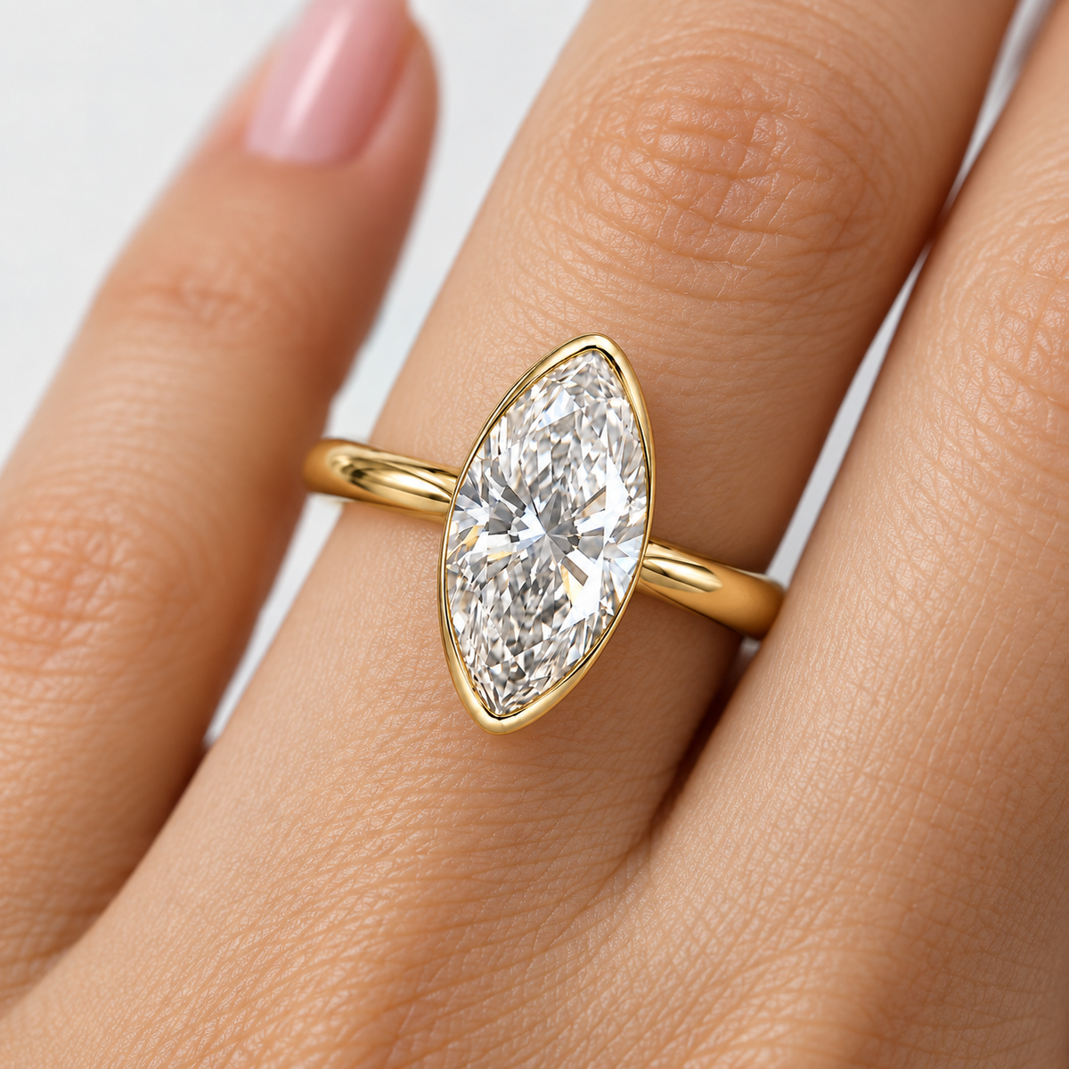 Lab Grown Diamond Moval Cut Modified Brilliant Cut Bezel Solitaire Engagement Ring IGI Certified in 14K Yellow Gold