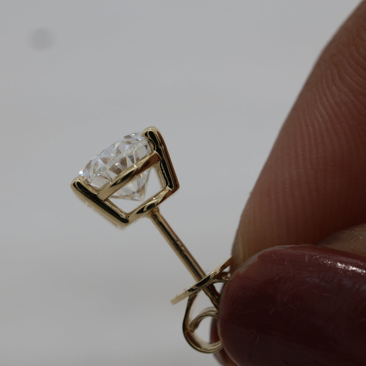 Lab Grown Oval Brilliant Cut Diamond Solitaire Stud Earring with Four-Prong Setting in 14K Yellow Gold