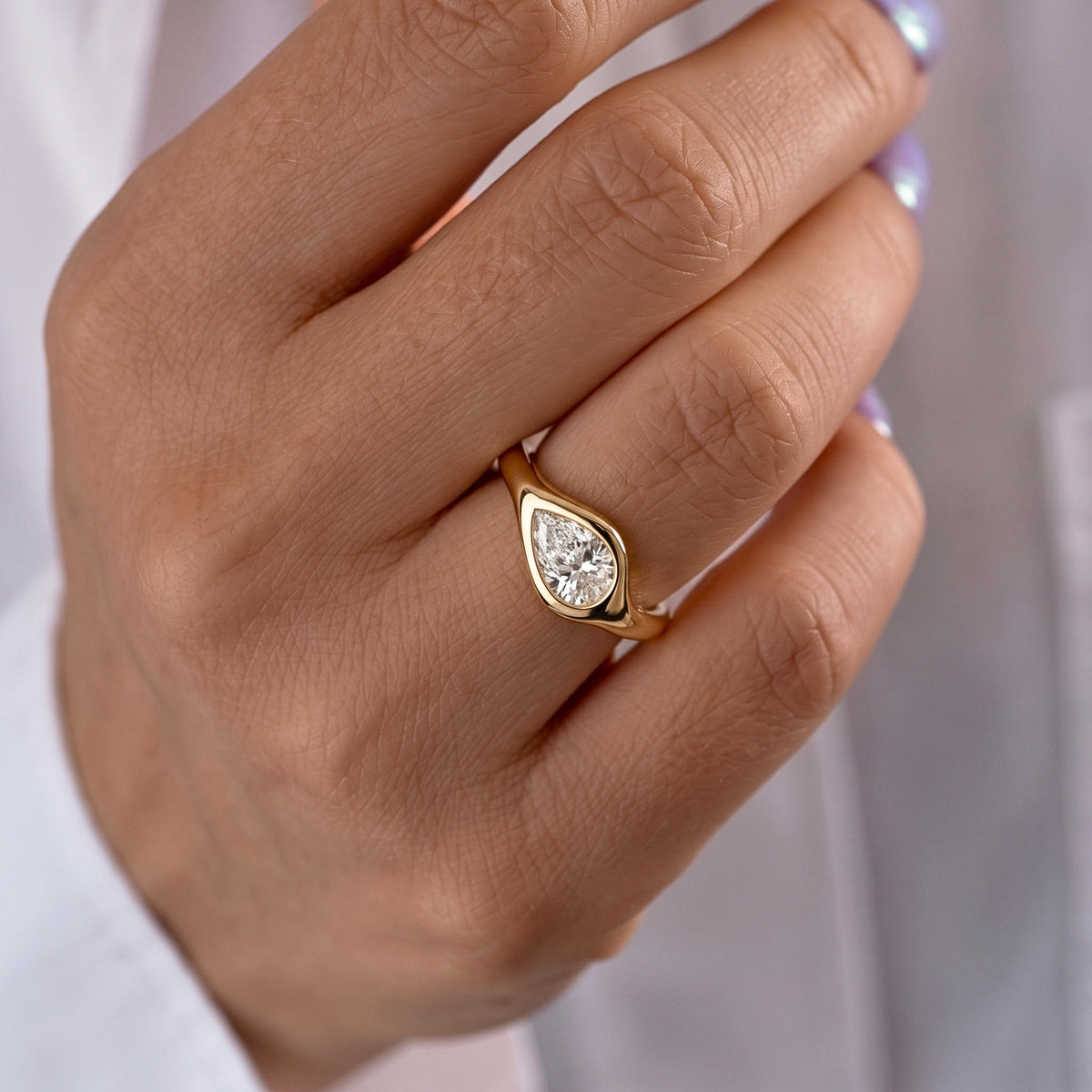 Lab Grown Diamond Pear Cut East-West Organic Wavy Bezel Engagement Ring IGI Certified in 14K Yellow Gold
