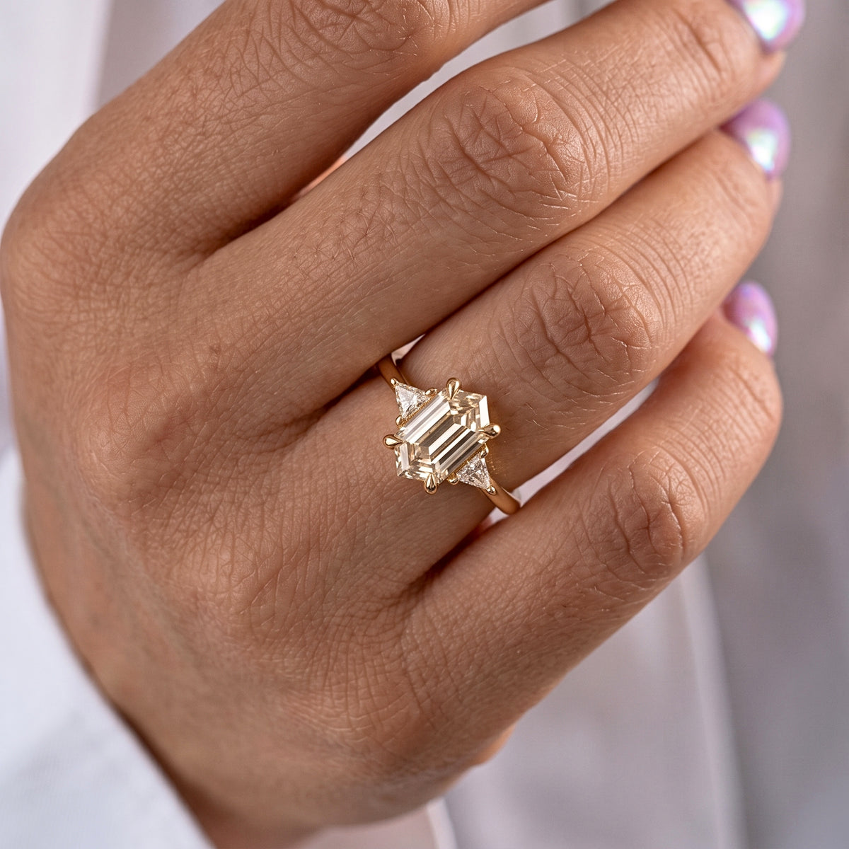Lab Grown Diamond Elongated Hexagon Step Cut Classic Plain Solitaire Engagement Ring with Triangle Trillion Side Accents IGI Certified in 14K Yellow Gold