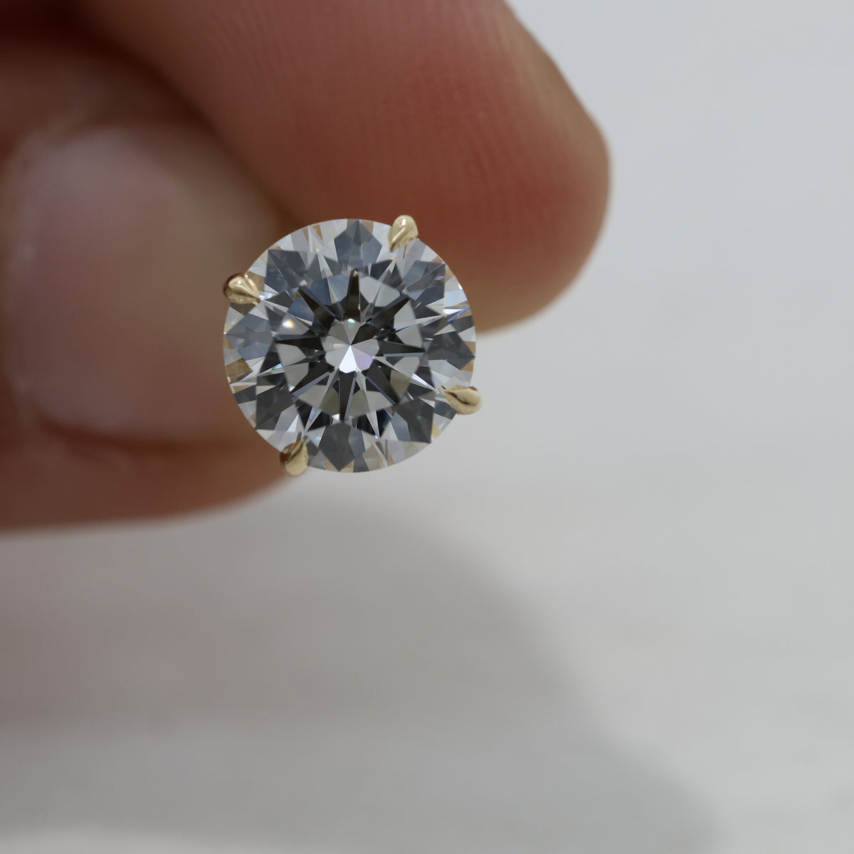 Lab Grown Round Brilliant Cut Diamond Solitaire Stud Earrings with Four-Prong Setting in 14K Yellow Gold