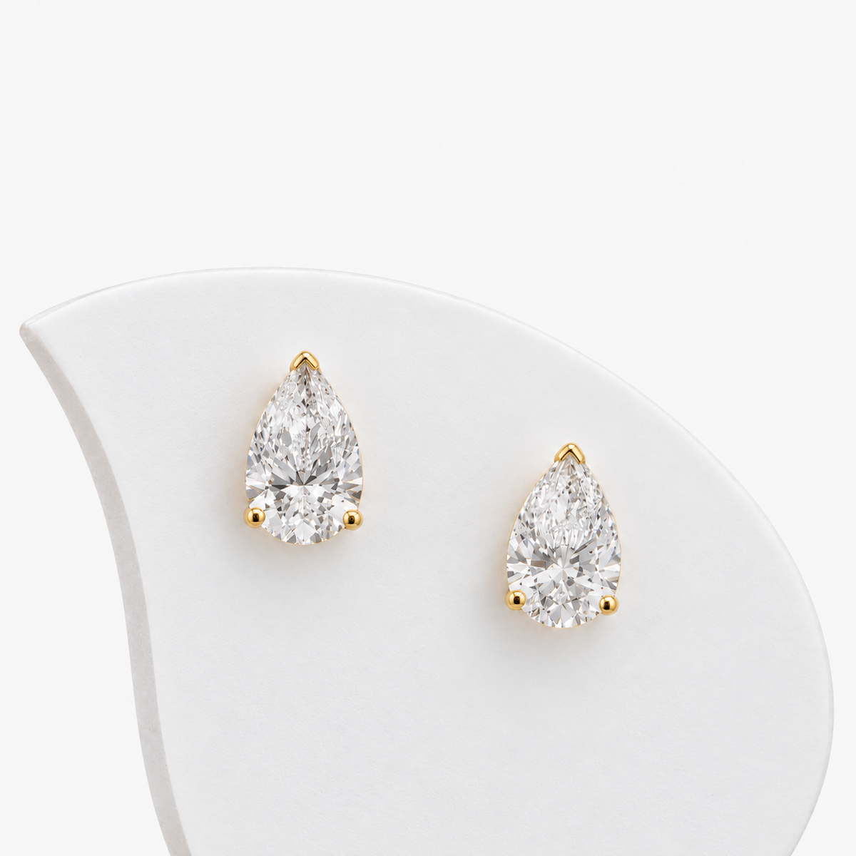 Lab Grown Diamond Pear Cut Three-Prong V-Cap Setting Stud Earrings IGI Certified in 14K Yellow Gold