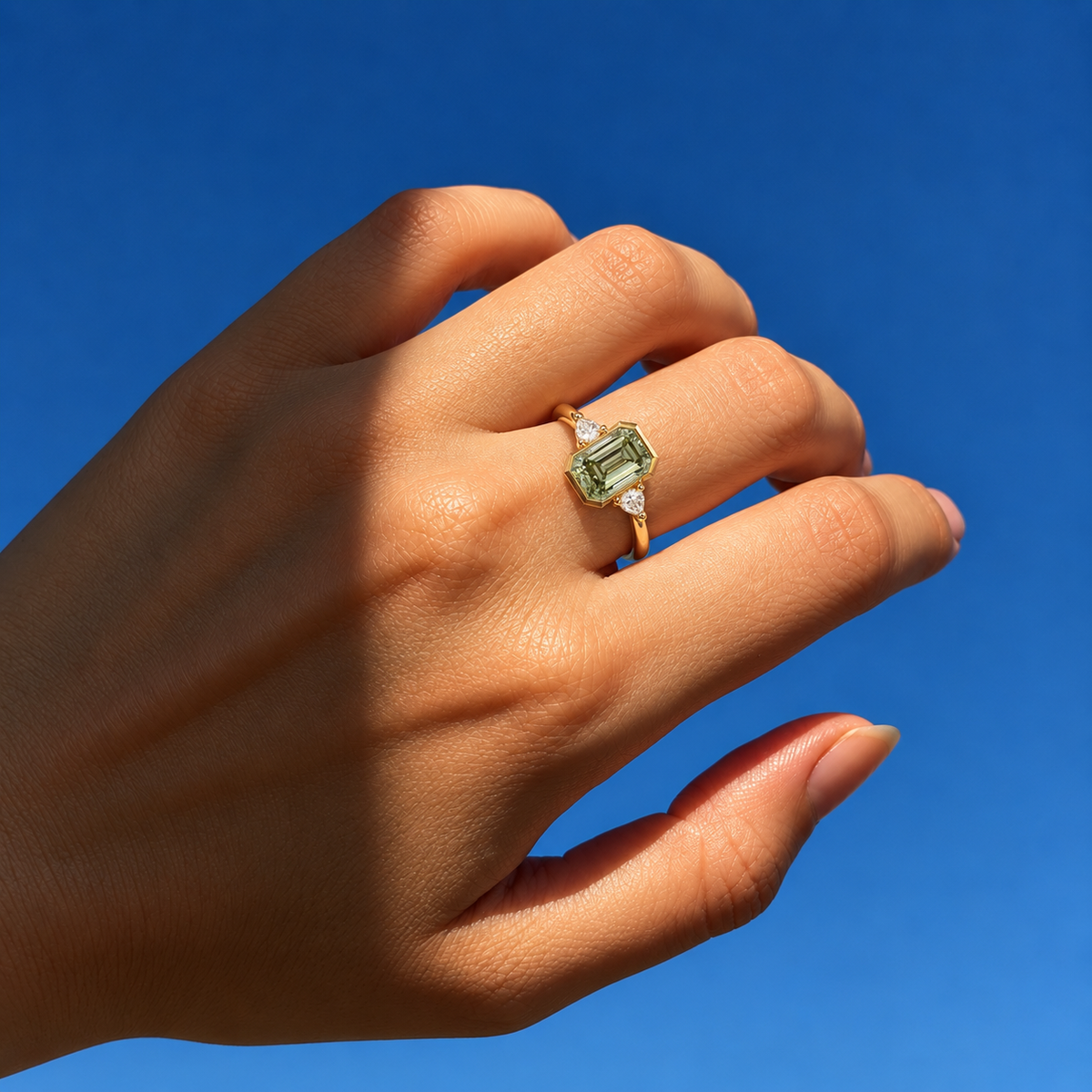 Lab Grown Green Emerald Cut Three Stone Engagement Ring with Pear Diamond Side Accents in 14K Yellow Gold