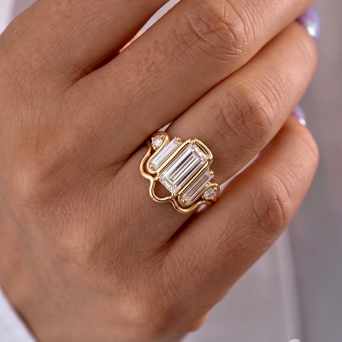Lab Grown Diamond Elongated Emerald Cut Floating Bezel Curved Wave Nested Band Baguette Accent Engagement Ring IGI Certified in 14K Yellow Gold (Copy)