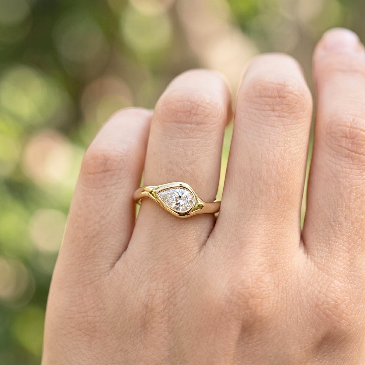 Lab Grown Diamond Pear Cut East-West Organic Wavy Bezel Engagement Ring IGI Certified in 14K Yellow Gold