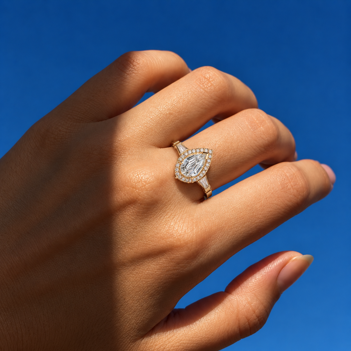 Lab Grown Diamond Pear Step Cut Micro-Pavé Halo Three-Stone Tapered Baguette Side Accent Engagement Ring IGI Certified in 14K Yellow Gold