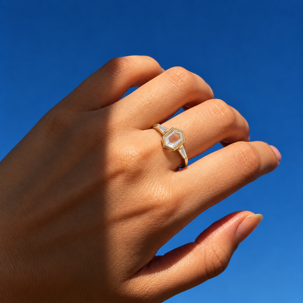 Lab Grown Diamond   Elongated Hexagon Portrait Cut Lab Grown Diamond Three Stone Engagement Ring   with Bezel Set Center and Tapered Baguette Side Diamonds in 14K Yellow Gold