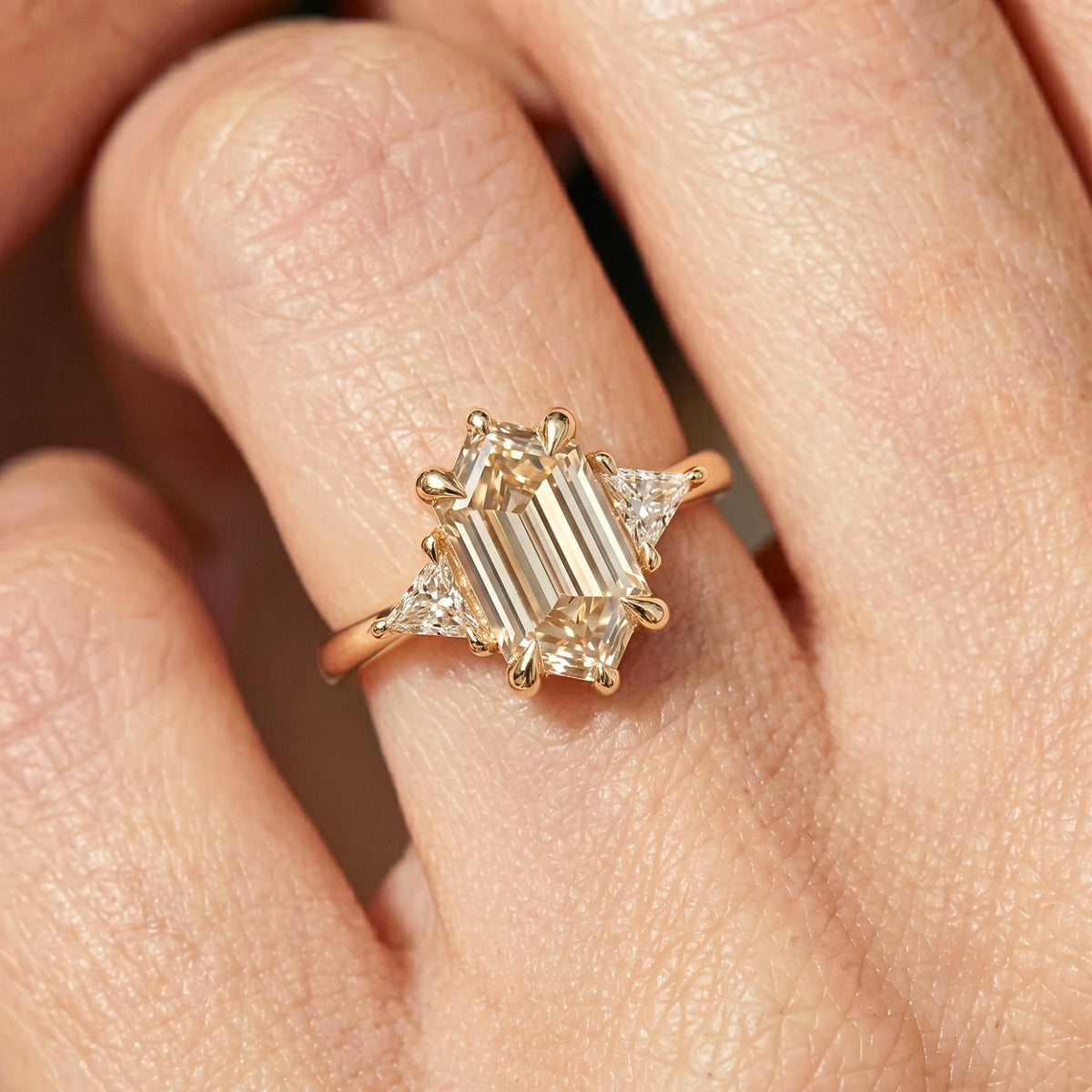 Lab Grown Diamond Elongated Hexagon Step Cut Classic Plain Solitaire Engagement Ring with Triangle Trillion Side Accents IGI Certified in 14K Yellow Gold