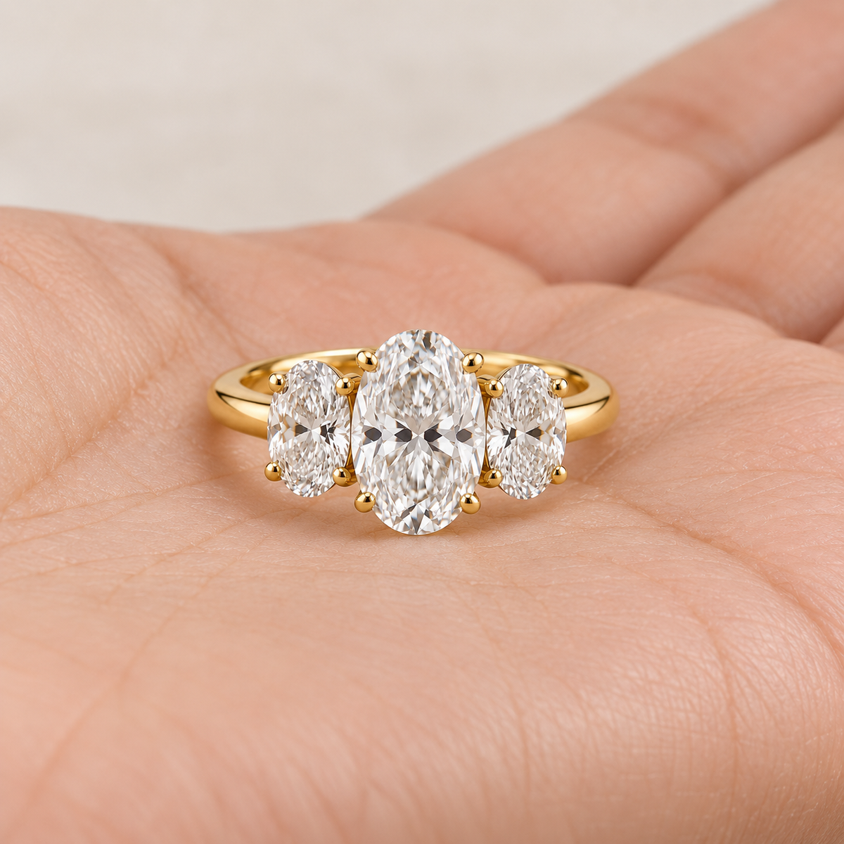 Lab Grown Diamond Oval Cut Three Stone Engagement Ring with Oval Side Stones in 14K Yellow Gold